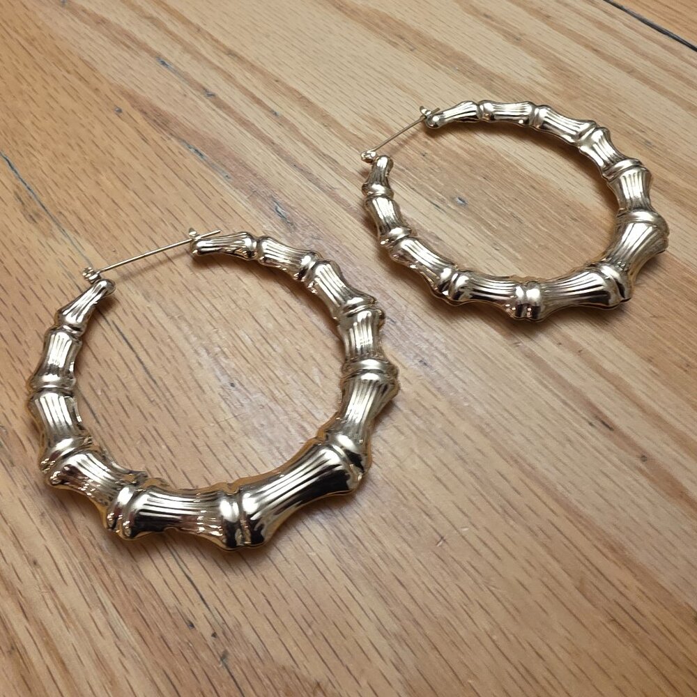 Claire's Vintage Gold Tone Bone Style Hoop Earrings